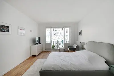 Un ou plusieurs lits dans un hébergement de l'établissement Bright Studio for 2 - Champs-Elysées