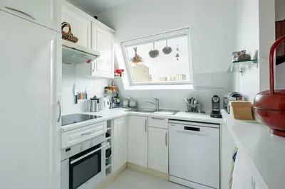 Cuisine ou kitchenette dans l'établissement Veeve - Beaugrenelle Skies