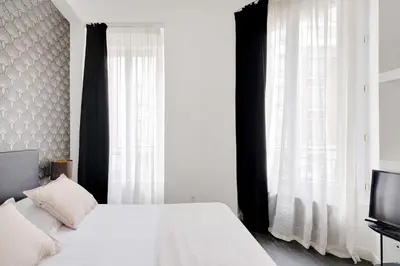 Un ou plusieurs lits dans un hébergement de l'établissement Stunning apartment - 2BR-6P - Grand Boulevard