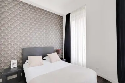Un ou plusieurs lits dans un hébergement de l'établissement Stunning apartment - 2BR-6P - Grand Boulevard