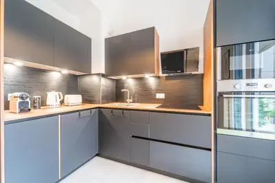 Cuisine ou kitchenette dans l'établissement L'Exupéry- Parking privé et à 15min de Paris
