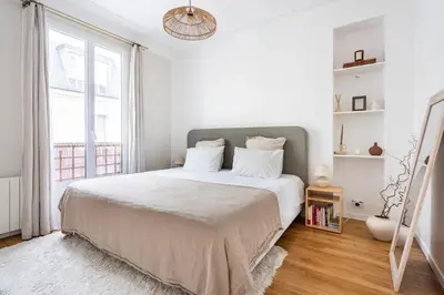 Un ou plusieurs lits dans un hébergement de l'établissement 100 m2 of luxury and comfort in Neuilly | By Airnest