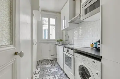 Cuisine ou kitchenette dans l'établissement Lovely & authentic Flat - Parc des Expos - Paris 15