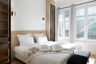 Un ou plusieurs lits dans un hébergement de l'établissement Pick A Flat's Apartment in Montorgueil - Rue Bachaumont
