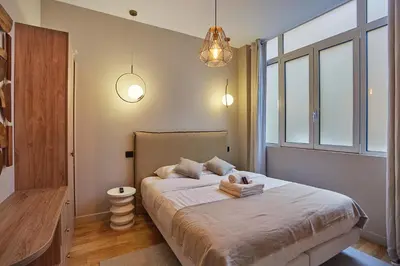 Un ou plusieurs lits dans un hébergement de l'établissement Residence Center of Paris by Studio prestige
