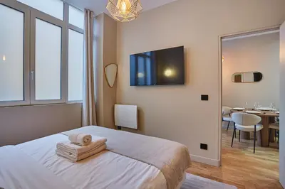 Un ou plusieurs lits dans un hébergement de l'établissement Residence Center of Paris by Studio prestige