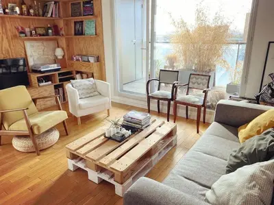 Coin salon dans l'établissement Appartement idéal JO à 10 min de Paris (metro 14)