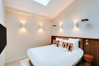 Un ou plusieurs lits dans un hébergement de l'établissement Fabuleux loft Blomet Tour Eiffel