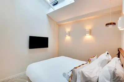 Un ou plusieurs lits dans un hébergement de l'établissement Fabuleux loft Blomet Tour Eiffel