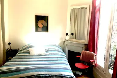 Un ou plusieurs lits dans un hébergement de l'établissement Appartement-dupleix Villa du Parc 19th century