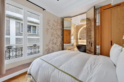 Un ou plusieurs lits dans un hébergement de l'établissement AV Experiences - Appartement Montaigne Luxury