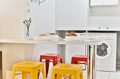 Cuisine ou kitchenette dans l'établissement Appartement proche Canal Saint Martin