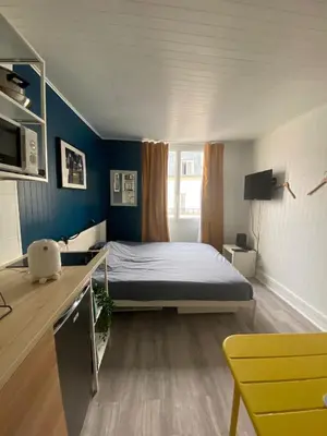 Télévision ou salle de divertissement dans l'établissement Bright Central Flat PARIS