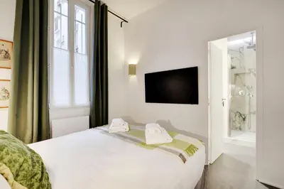 Un ou plusieurs lits dans un hébergement de l'établissement Pick A Flat's Apartment in Saint-Michel - Rue Pestalozzi