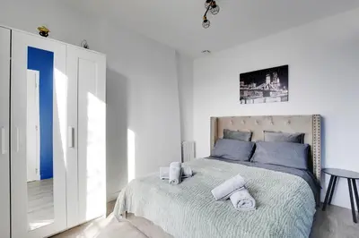 Un ou plusieurs lits dans un hébergement de l'établissement Appartement Suite 41 aux Portes de Paris