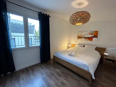 Un ou plusieurs lits dans un hébergement de l'établissement Joli Duplex Confort T2 Paris Porte De Versailles