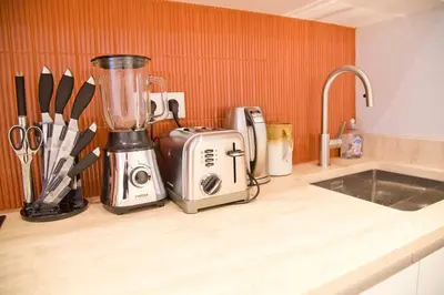 Cuisine ou kitchenette dans l'établissement Lola - Design 2BR Suite Mouffetard Pantheon