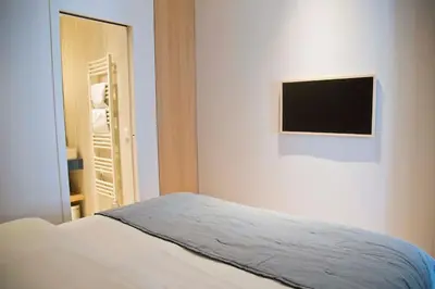 Un ou plusieurs lits dans un hébergement de l'établissement Margot - Luxury 2BR Mouffetard Historic Heights