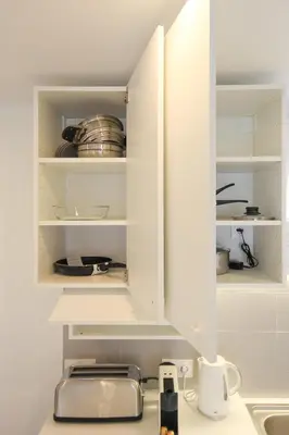 Cuisine ou kitchenette dans l'établissement Centre Malakoff, Bel Appartement meublé à 500 mètres du Métro Ligne 13