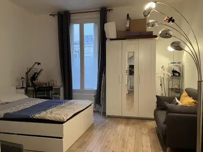 Un ou plusieurs lits dans un hébergement de l'établissement Appartement Cosy Paris 16 Saint Cloud