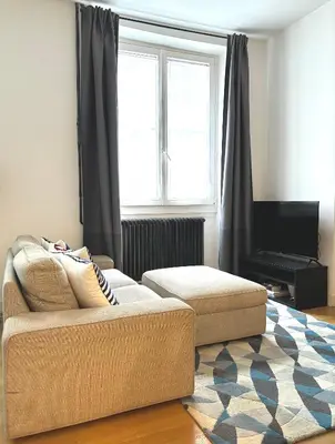 Coin salon dans l'établissement Marais Modern & Spacious Studio