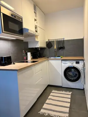 Cuisine ou kitchenette dans l'établissement Marais Modern & Spacious Studio