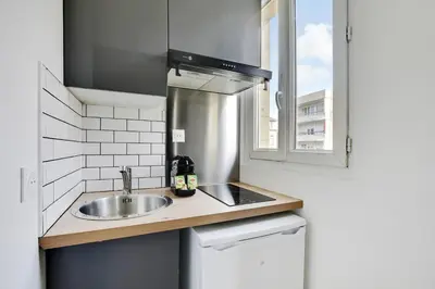 Cuisine ou kitchenette dans l'établissement Appartement Suite 43 aux Portes de Paris