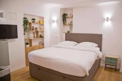 Un ou plusieurs lits dans un hébergement de l'établissement Luxury Apt Raspail Denfert