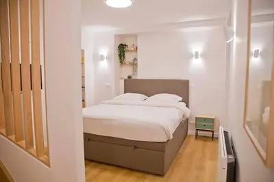 Un ou plusieurs lits dans un hébergement de l'établissement Luxury Apt Raspail Denfert