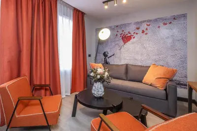 Coin salon dans l'établissement Appart'hôtel East Paris Suite