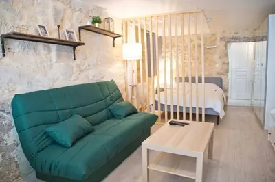 Un ou plusieurs lits dans un hébergement de l'établissement Isaure - Stylish Studio Sorbonne District