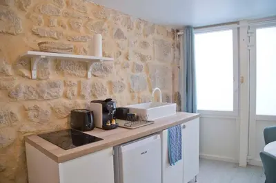 Cuisine ou kitchenette dans l'établissement Isaure - Stylish Studio Sorbonne District