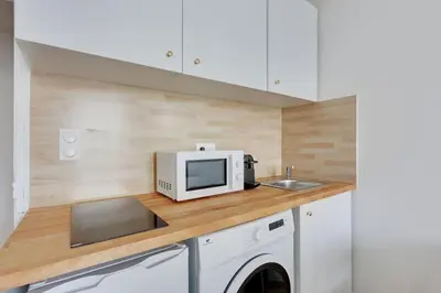 Cuisine ou kitchenette dans l'établissement Appartement Suite aux Portes de Paris