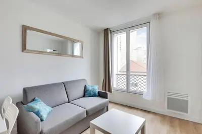 Coin salon dans l'établissement Appartement Suite aux Portes de Paris