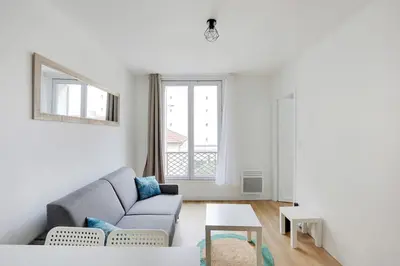 Coin salon dans l'établissement Appartement Suite aux Portes de Paris