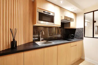 Cuisine ou kitchenette dans l'établissement Pick A Flat's Apartment in Odeon - Rue Saint André des Arts