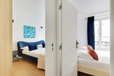 Un ou plusieurs lits dans un hébergement de l'établissement Renovated and modern 4BD for 12 guests