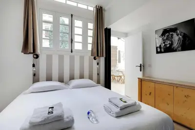 Un ou plusieurs lits dans un hébergement de l'établissement Magnificent loft Porte Versailles & Champs de Mars