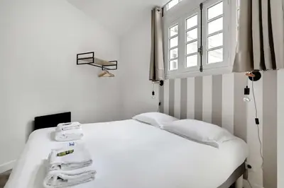 Un ou plusieurs lits dans un hébergement de l'établissement Magnificent loft Porte Versailles & Champs de Mars