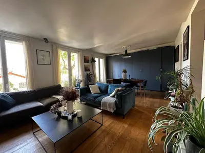 Coin salon dans l'établissement Charmant Appartement Parisien