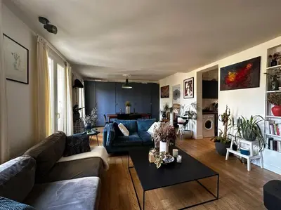 Coin salon dans l'établissement Charmant Appartement Parisien