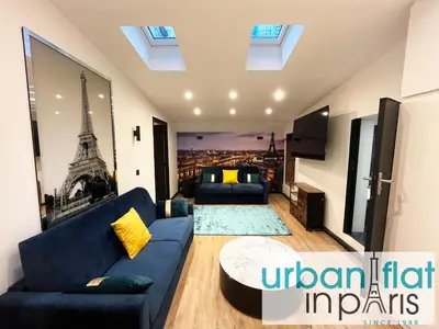 Coin salon dans l'établissement Urban Flat 175 - Loft St Denis