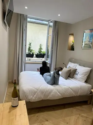 Un ou plusieurs lits dans un hébergement de l'établissement Les Chambres du Faubourg