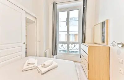 Un ou plusieurs lits dans un hébergement de l'établissement Appartement au cœur du Marais - III
