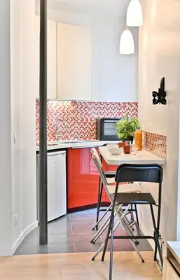 Cuisine ou kitchenette dans l'établissement Appartement au cœur du Marais - III