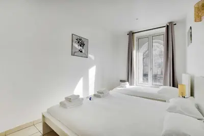 Un ou plusieurs lits dans un hébergement de l'établissement Cozy apartment - 1BR-3P - Gare du Nord