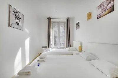 Un ou plusieurs lits dans un hébergement de l'établissement Cozy apartment - 1BR-3P - Gare du Nord