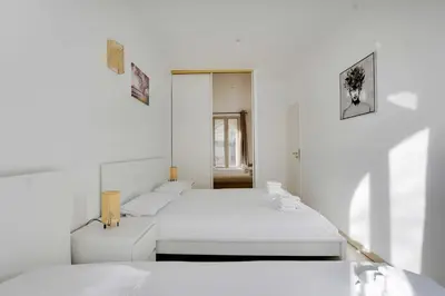 Un ou plusieurs lits dans un hébergement de l'établissement Cozy apartment - 1BR-3P - Gare du Nord