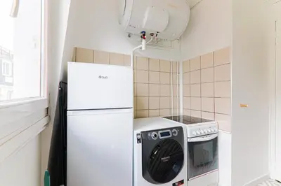 Cuisine ou kitchenette dans l'établissement Appartement Quartier Le Marais Free Netflix