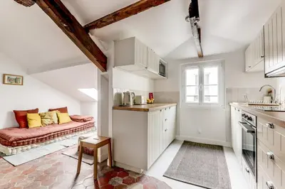 Cuisine ou kitchenette dans l'établissement Appartement de charme sous les toits